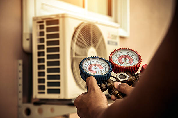 Professional Air Conditioning Service technician working in East Dennis, MA